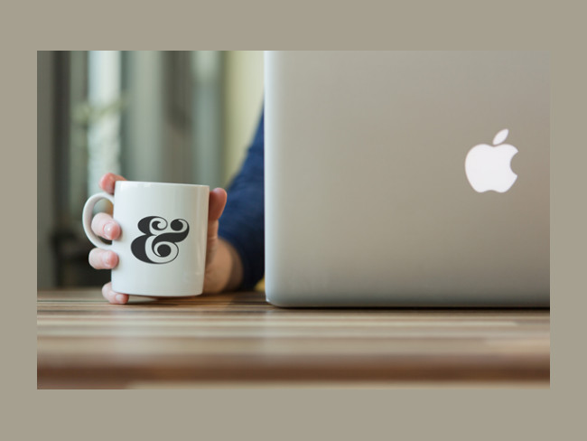 Free PSD Coffee Cup Mockup with Apple Macbook Pro