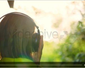 Girl Listening To Music In Headphones Outdoor