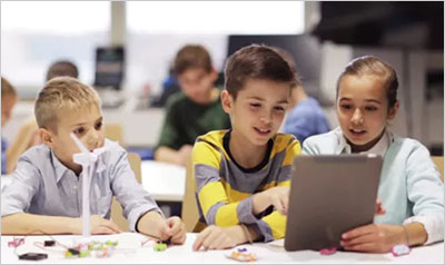 Kids with Tablet Pc Programming at Robotics School